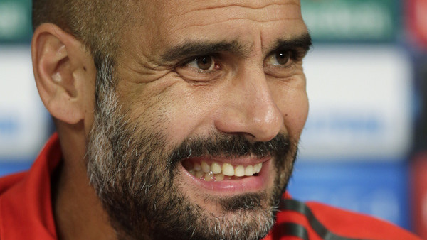Bayern's head coach Pep Guardiola attends a press conference ahead of Wednesday's Champions League group E soccer match between FC Bayern Munich and Manchester City, in Munich, southern Germany, Tuesday, Sept. 16, 2014. (AP Photo/Matthias Schrader