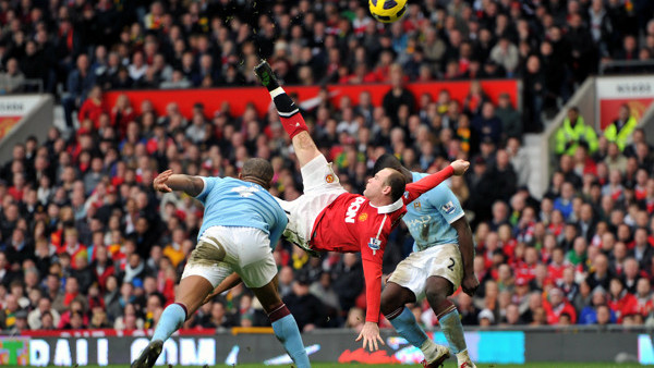 File photo dated 12/02/2011 of Manchester United's Wayne Rooney (centre) scoring their second goal from inside the penalty area from an overhead kick.