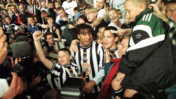 Alan Shearer dressed in the Newcastle strip, greets the fans of Newcastle United after he was officially introduced as their new signing at St James's Park.