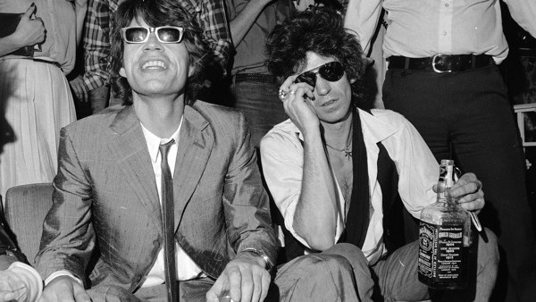 Mick Jagger, left, and Keith Richards of the Rolling Stones relax during  a party at Danceteria in New York, celebrating the release of their new album Emotional Rescue