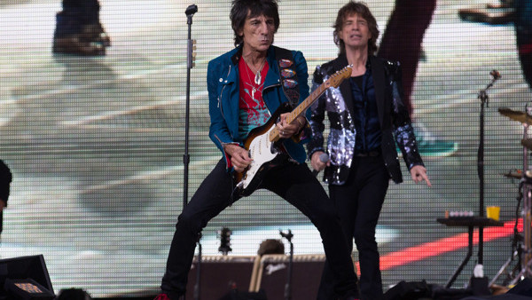 Rolling Stones singer Mick Jagger, right, and basist Ronnie Wood, left, perform during a concert in Berlin, Tuesday, June 10, 2014. The concert at the Waldbuehne stage is the first of two concerts in Germany as part of the '14 On Fire' tour of the British