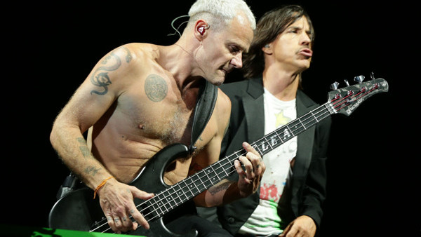 Flea and Anthony Kiedis of the Red Hot Chilli Pepers performing on the Main Stage, at the Isle of Wight Festival in Seaclose Park, Newport, Isle of Wight.