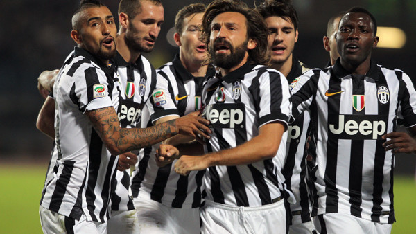 Juventus Andrea Pirlo, center, celebrates with his teammates after scoring during a Serie A soccer match between Empoli and Juventus at the Carlo Castellani stadium, in Empoli, Italy, Saturday, Nov. 1, 2014. (AP Photo/ Massimo Pinca)