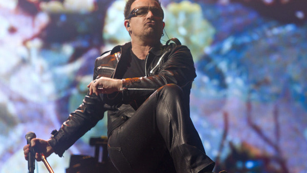 FILE - In this June 24, 2011 file photo, Bono, of British rock band U2, performs at Glastonbury Music Festival in Glastonbury, England. U2 on Wednesday, Dec. 3, 2014 said it will hit the stage in Vancouver in May 2015 to open a 19-city tour, playing indoo