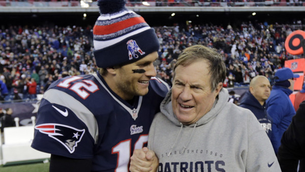 New England Patriots quarterback Tom Brady, left, celebrates with head coach Bill Belichick after defeating the Miami Dolphins 41-13 in an NFL football game Sunday, Dec. 14, 2014, in Foxborough, Mass. (AP Photo/Charles Krupa)