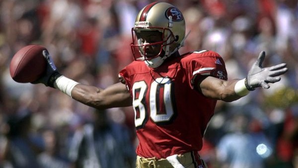 ** FILE ** San Francisco 49ers wide receiver Jerry Rice celebrates a first-quarter touchdown reception against the Arizona Cardinals, in this Oct. 1, 2000 file photo, in San Francisco. Unwilling to be a bit player with the Denver Broncos, Rice retired Mon