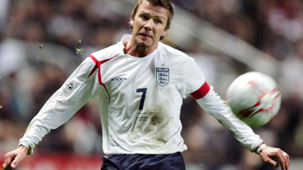 ** FILE ** England's captain David Beckham tries his free kick shot towards the goal during their World Cup Group 6 qualifier soccer match at at St James Park ground, in Newcastle, England, in this March 30, 2005 file photo. Beckham, the former Englan