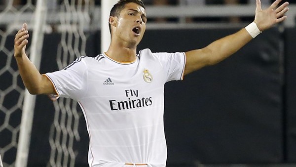 Real Madrid's Cristiano Ronaldo, right, reacts to a call during the first half of the International Champions Cup soccer match as Los Angeles Galaxy's A.J. DeLaGarza looks away, Thursday, Aug. 1, 2013, in Glendale, Ariz. (AP Photo/Matt York)