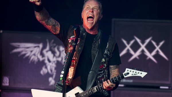 James Hetfield from Metallica performs at a private concert for SiriusXM listeners at the Apollo Theater on Saturday, Sept. 21, 2013 in New York. (Photo by Charles Sykes/Invision/AP)