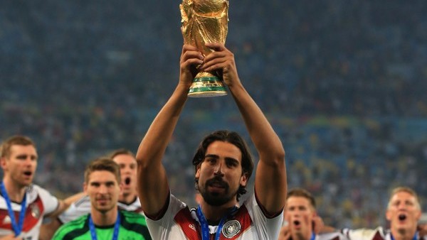 Germany's Sami Khedira celebrates with the FIFA World Cup Trophy