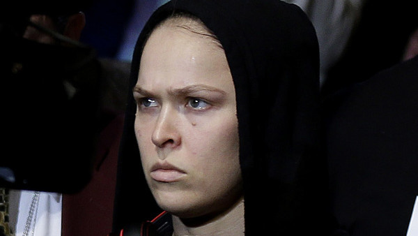 Ronda Rousey enters the arena for a UFC 170 mixed martial arts women's bantamweight title fight against Sara McMann on Saturday, Feb. 22, 2014, in Las Vegas. (AP Photo/Isaac Brekken)