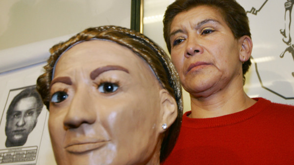 Juana Barraza, 48, is presented to the media next to a bust the police used to help in the search for a serial murder suspect at the Mexico City police headquarters Wednesday Jan. 25, 2006. Police say Barraza matches the profile of a believed serial murde