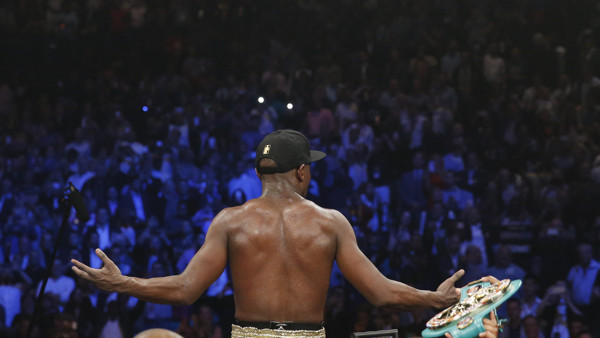 Floyd Mayweather Jr., left, punches Manny Pacquiao, from the Philippines, during their welterweight title fight on Saturday, May 2, 2015 in Las Vegas. (AP Photo/Isaac Brekken)