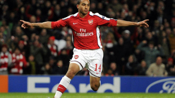 Arsenal's Theo Walcott celebrates his goal during the Champions League quarterfinal first leg soccer match between Arsenal and Barcelona at the Emirates Stadium in London, Wednesday, March 31, 2010. (AP Photo/Tom Hevezi)