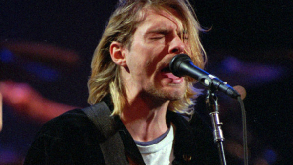 FILE - This Dec. 13, 1993 file photo shows Kurt Cobain of the Seattle band Nirvana performing in Seattle, Wash. It's been two decades since the Nirvana frontman took his own life yet he remains on in the thoughts of those he influenced and entertained