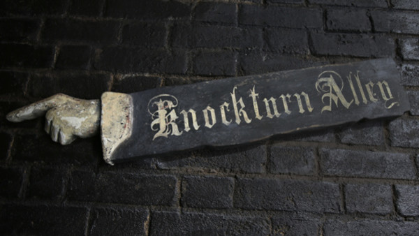 A sign directs guests to Knockturn Alley during a preview of Diagon Alley at the Wizarding World of Harry Potter at Universal Orlando, Thursday, June 19, 2014, in Orlando, Fla. (AP Photo/John Raoux)