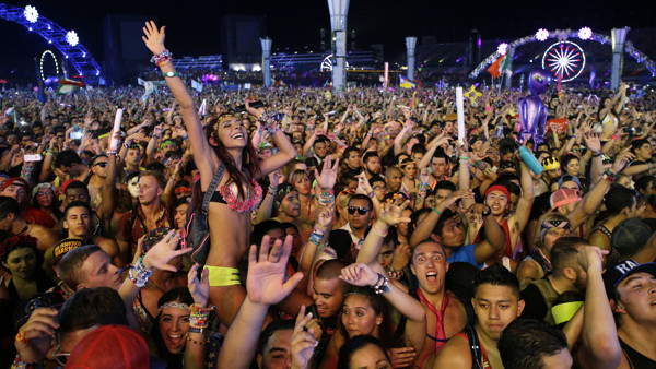 FILE - In this Saturday, June 21, 2014 file photo, carnival goers dance to music by Krewella at the Electric Daisy Carnival in Las Vegas. Organizers of the Electric Daisy Carnival music festival which is winding down its dance party beats at the Las Vegas