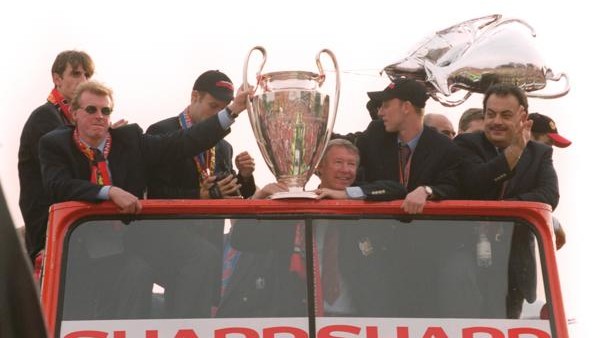 Manchester United manager Alex Ferguson and midfielder Nicky Butt (right) with the European Cup on the team's tour of Manchester after becoming the second team to win the 