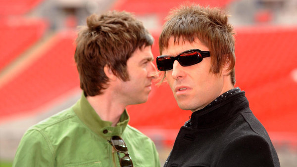 Oasis band members Noel Gallagher and Liam Gallagher are pictured during a photocall at Wembley Stadium, where they announced their biggest ever tour of open air venues in the UK and Ireland next summer.
