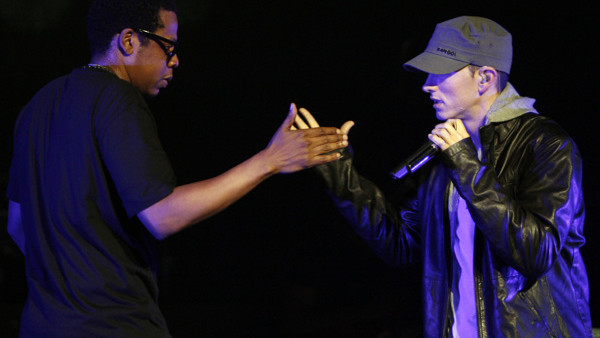 Rappers Eminem, right, and Jay-Z perform together at a concert celebrating the launch of the video game