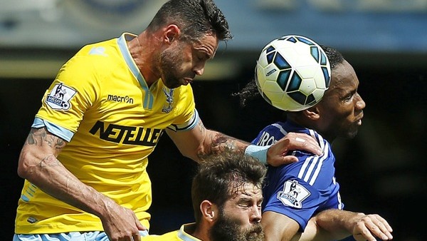Chelsea's Didier Drogba, right, battles for a header with Crystal Palaces Joe Ledley, centre, and Damien Delaney during the English Premier League soccer match between Chelsea and Crystal Palace at Stamford Bridge stadium in London, Sunday, May 3, 201