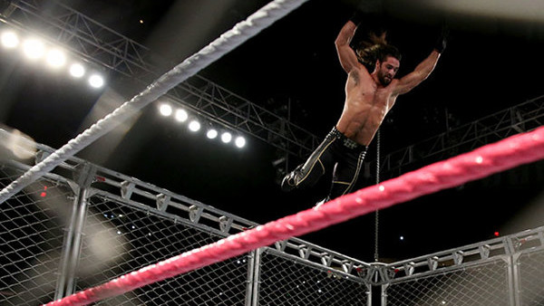 seth rollins dives off the cage
