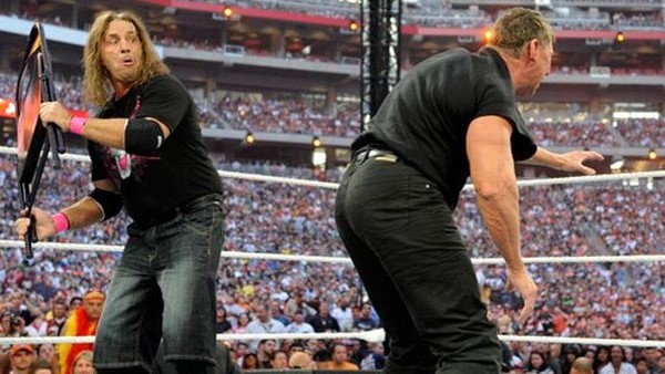 Paul Heyman, left, celebrates with Brock Lesnar after his win over the Undertaker during Wrestlemania XXX at the Mercedes-Benz Super Dome in New Orleans on Sunday, April 6, 2014. (Jonathan Bachman/AP Images for WWE)